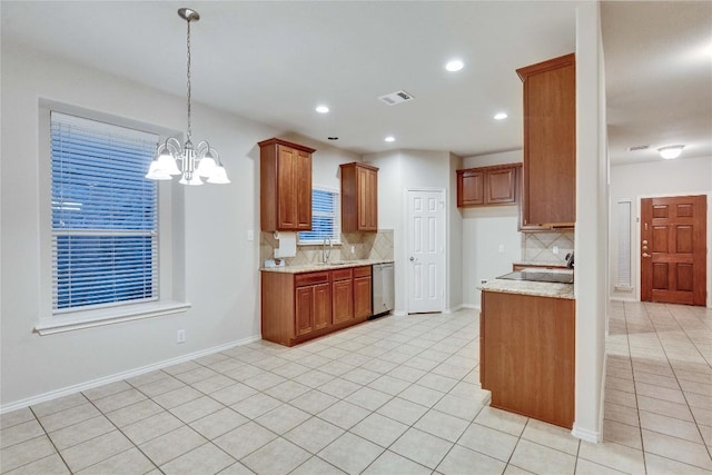 kitchen with stainless steel dishwasher, backsplash, visible vents, and brown cabinets