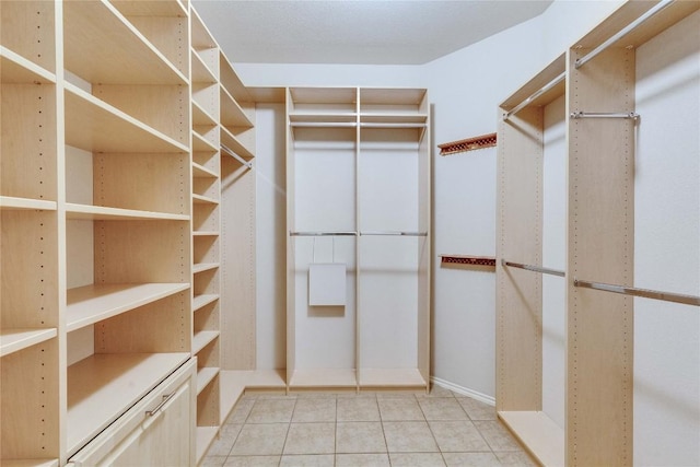 walk in closet featuring light tile patterned floors