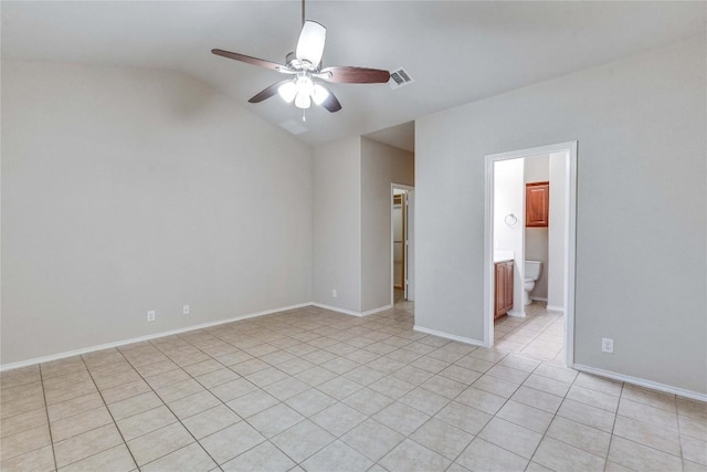unfurnished room featuring visible vents, lofted ceiling, baseboards, ceiling fan, and light tile patterned floors