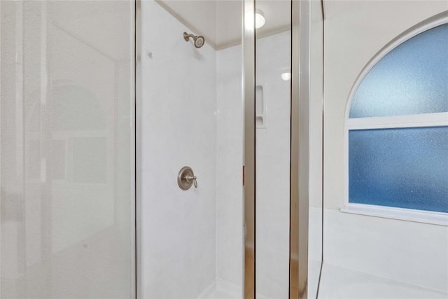 full bath featuring a stall shower