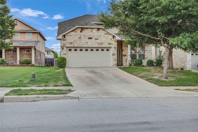 view of front of home featuring a garage, a front lawn, stone siding, and concrete driveway
