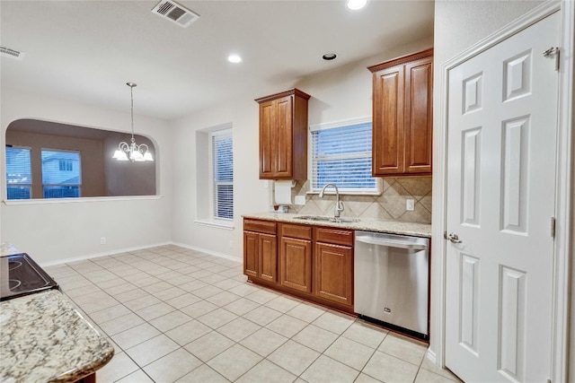 kitchen with stainless steel dishwasher, brown cabinetry, visible vents, tasteful backsplash, and a sink