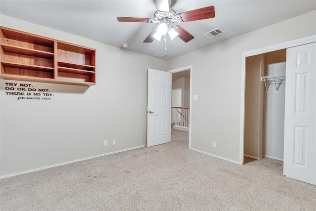 unfurnished bedroom featuring carpet flooring, baseboards, visible vents, and a closet