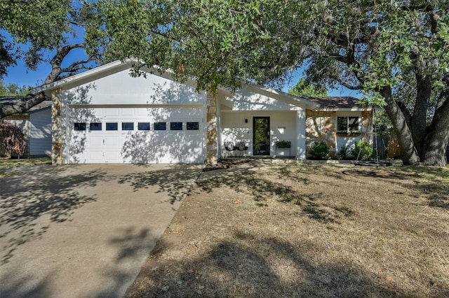 12218 Grimsley Dr, Austin, TX 78759 - ranch-style house with stucco siding, driveway, and a garage