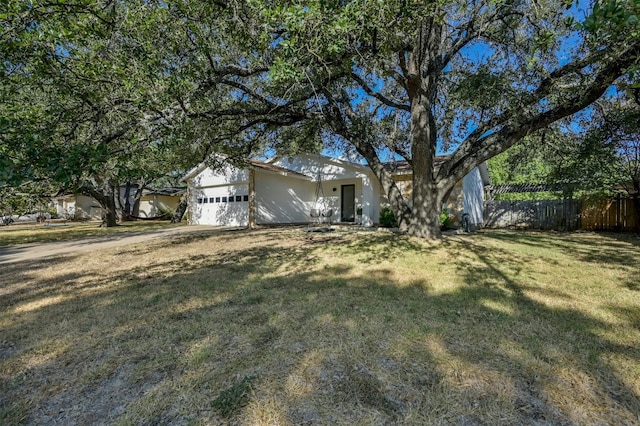 12218 Grimsley Dr, Austin, TX 78759 - view of yard featuring fence and a garage