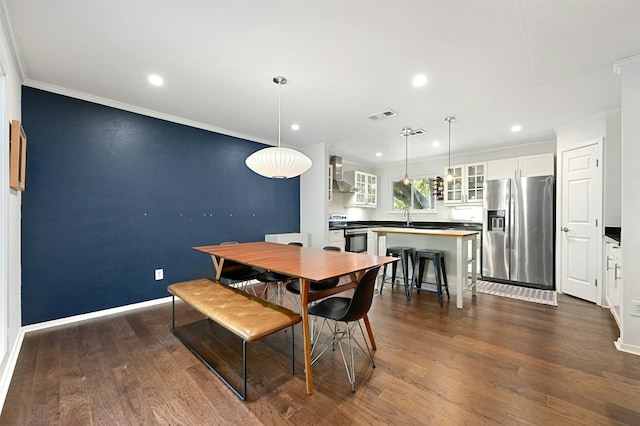 12218 Grimsley Dr, Austin, TX 78759 - dining space featuring crown molding, recessed lighting, dark wood-style floors, and visible vents
