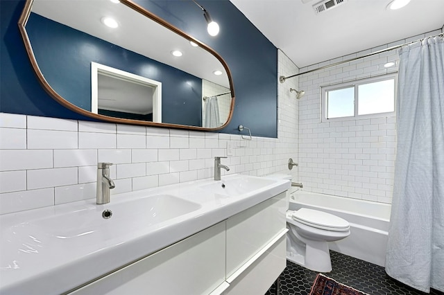 12218 Grimsley Dr, Austin, TX 78759 - bathroom featuring a sink, tile walls, shower / bath combo, and visible vents