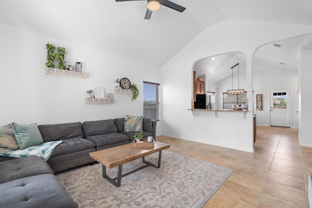 1307 Tamarac Trl, Leander, TX 78641 - living room with lofted ceiling, arched walkways, and a ceiling fan