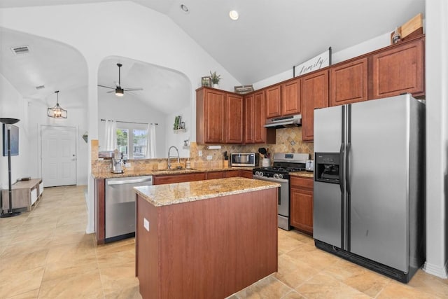 kitchen with a sink, ceiling fan, lofted ceiling, and stainless steel appliances
