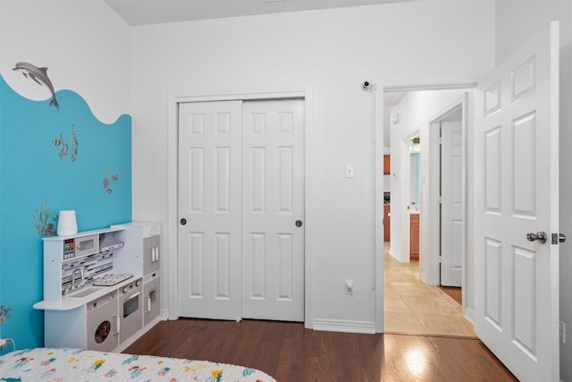 1307 Tamarac Trl, Leander, TX 78641 - bedroom featuring wood finished floors and a closet