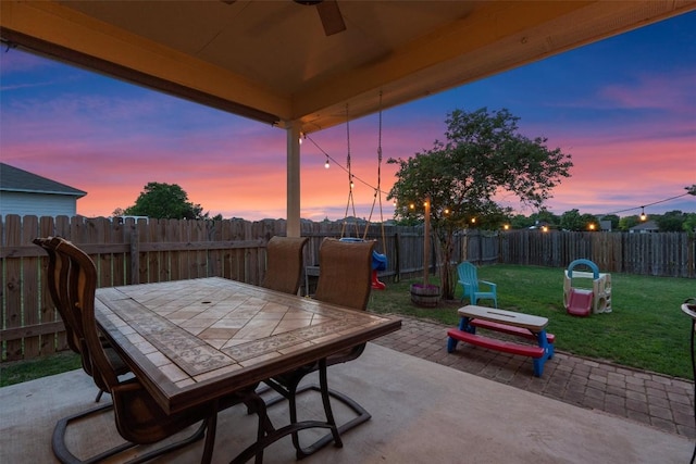 1307 Tamarac Trl, Leander, TX 78641 - fenced backyard featuring outdoor dining space, a patio, and a ceiling fan