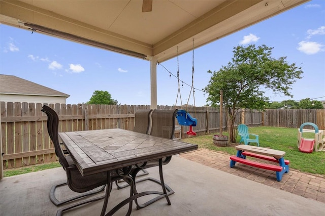 1307 Tamarac Trl, Leander, TX 78641 - fenced backyard featuring outdoor dining space, a patio, and ceiling fan