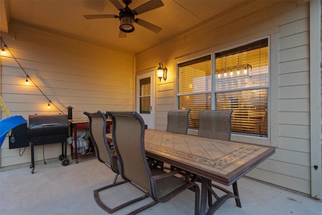 view of patio / terrace featuring outdoor dining area, ceiling fan, and area for grilling