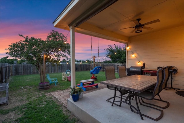view of patio / terrace featuring ceiling fan, outdoor dining space, a fenced backyard, and a grill