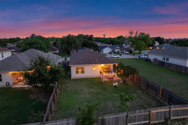aerial view at dusk with a residential view