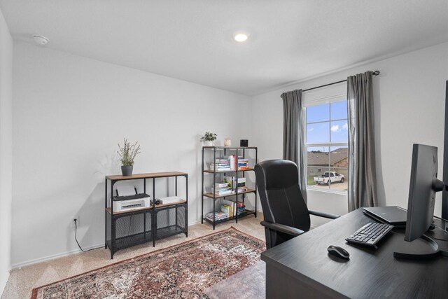 19216 Bear Grass Dr, Elgin, TX 78621 - carpeted home office with baseboards