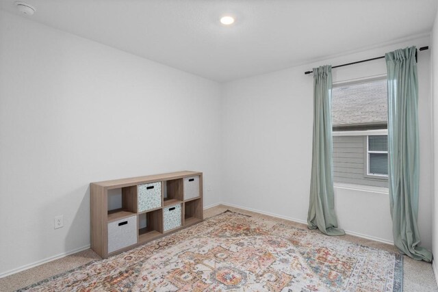 19216 Bear Grass Dr, Elgin, TX 78621 - carpeted spare room with a smoke detector and baseboards