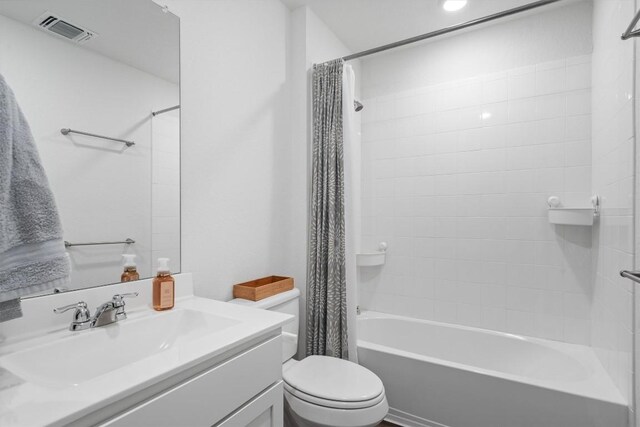 19216 Bear Grass Dr, Elgin, TX 78621 - full bathroom featuring vanity, toilet, and shower / bath combination with curtain
