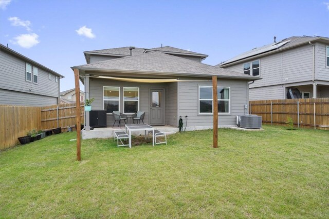19216 Bear Grass Dr, Elgin, TX 78621 - rear view of house with roof with shingles, central AC unit, and a patio
