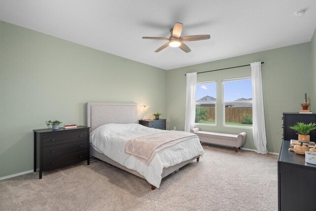 19216 Bear Grass Dr, Elgin, TX 78621 - bedroom with light colored carpet, baseboards, and a ceiling fan