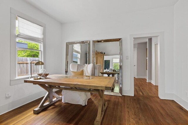 office featuring baseboards and wood finished floors