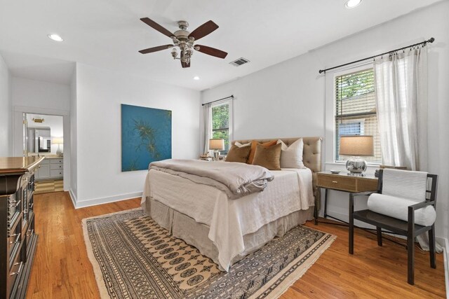 bedroom featuring recessed lighting, multiple windows, light wood-type flooring, and visible vents