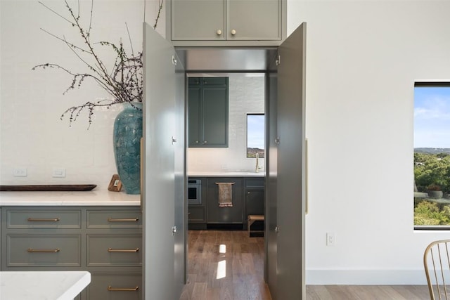 5914 Cape Coral Dr, Austin, TX 78746 - bathroom featuring wood finished floors, vanity, and baseboards