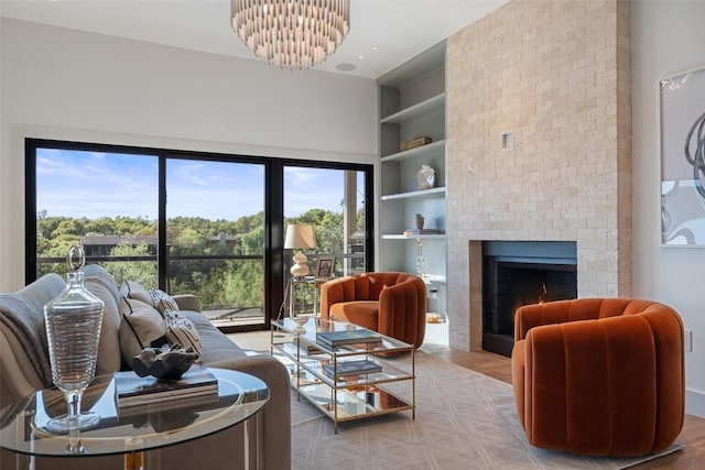 5914 Cape Coral Dr, Austin, TX 78746 - living area featuring a chandelier, built in shelves, a brick fireplace, and wood finished floors