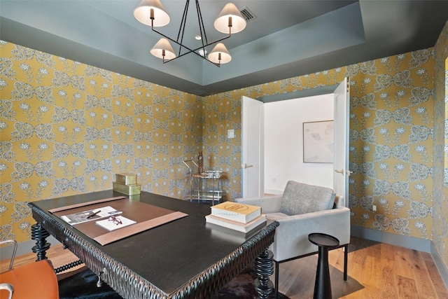 5914 Cape Coral Dr, Austin, TX 78746 - home office featuring wood finished floors, wallpapered walls, and baseboards