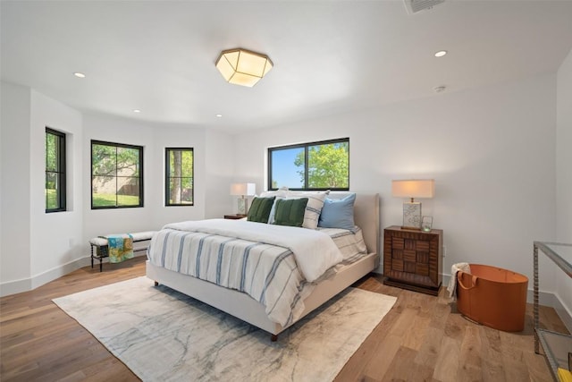 5914 Cape Coral Dr, Austin, TX 78746 - bedroom with baseboards, wood finished floors, and recessed lighting