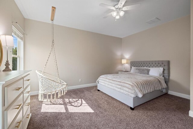 bedroom featuring light colored carpet, a ceiling fan, baseboards, and visible vents