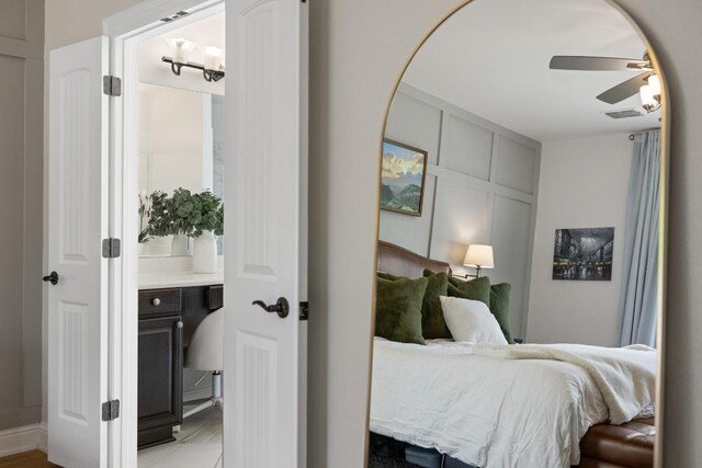 bedroom with ceiling fan and visible vents
