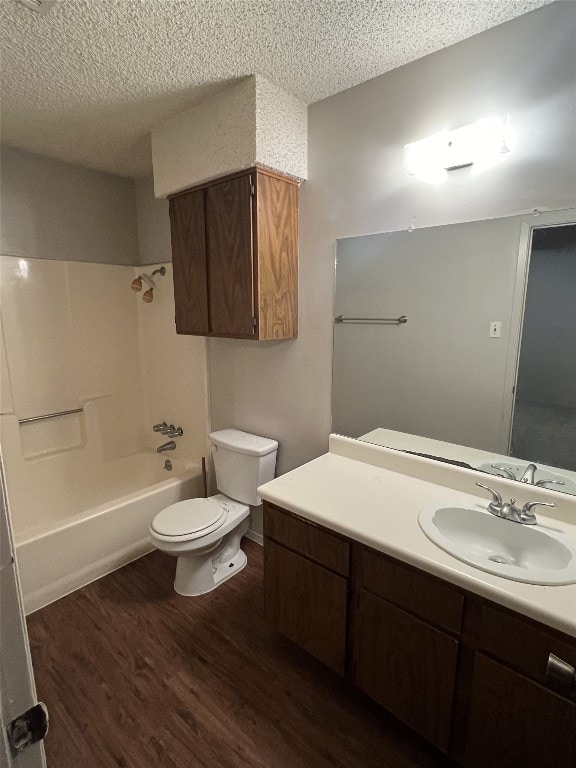 8105 Dowling Cv, Austin, TX 78745 - bathroom featuring a textured ceiling, wood finished floors, vanity, and shower / tub combination