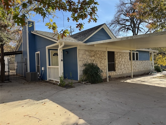 8105 Dowling Cv, Austin, TX 78745 - view of front of property featuring stone siding and roof with shingles