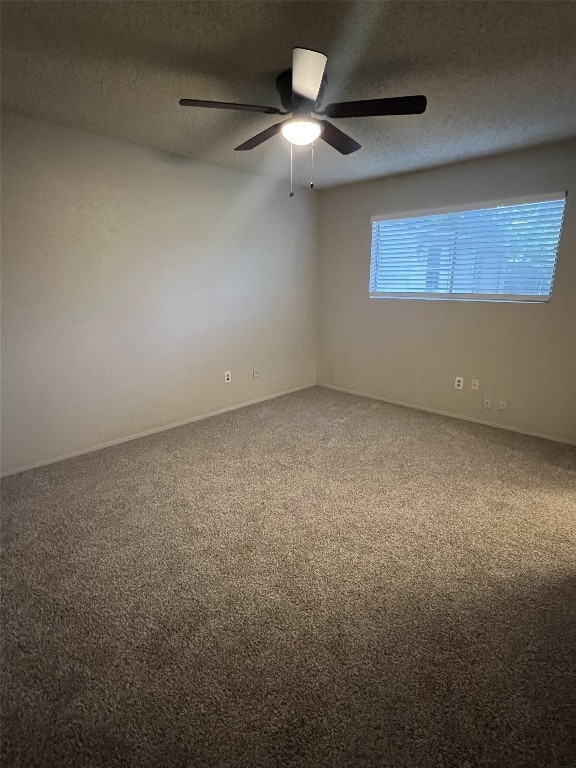 8105 Dowling Cv, Austin, TX 78745 - spare room featuring carpet flooring, a ceiling fan, and a textured ceiling