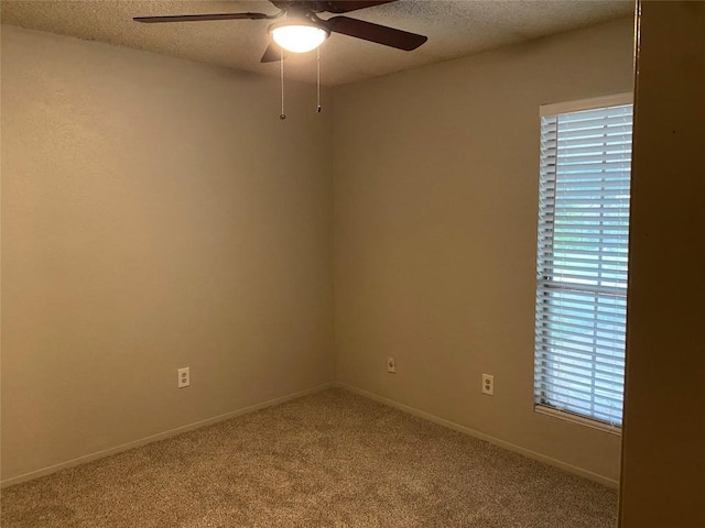 8105 Dowling Cv, Austin, TX 78745 - carpeted spare room with a textured ceiling and a ceiling fan
