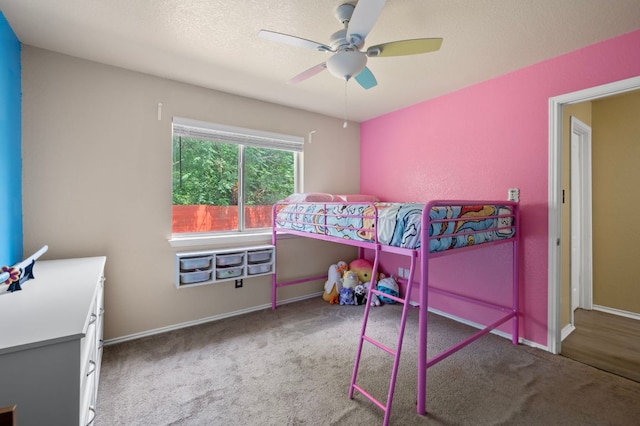 carpeted bedroom with baseboards and a ceiling fan