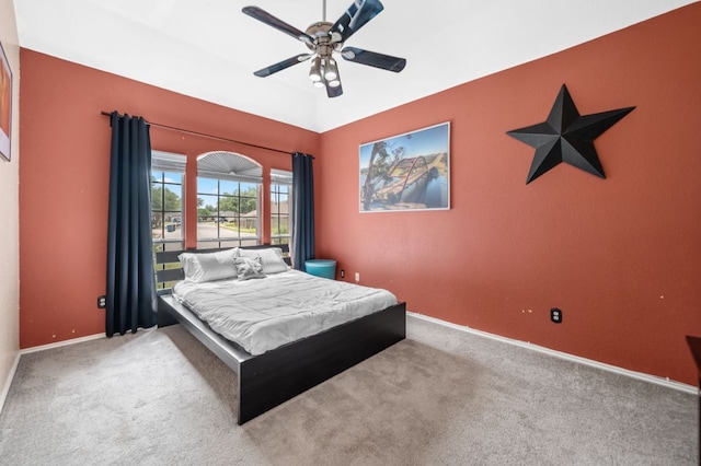 bedroom featuring carpet floors, a ceiling fan, and baseboards