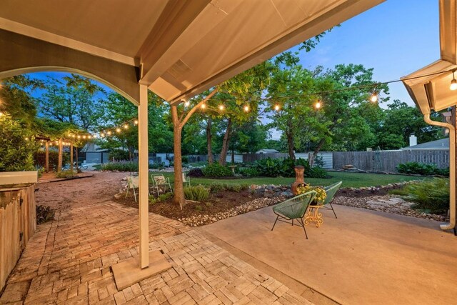 view of patio / terrace with a storage shed, an outbuilding, and a fenced backyard