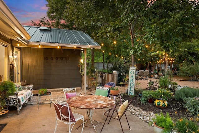 patio terrace at dusk with outdoor dining area