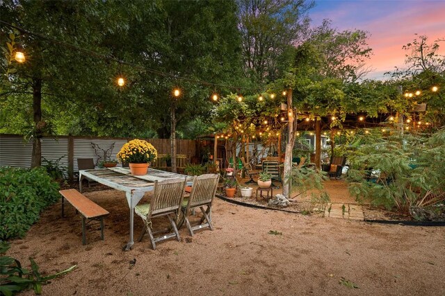 exterior space with fence and outdoor dining space
