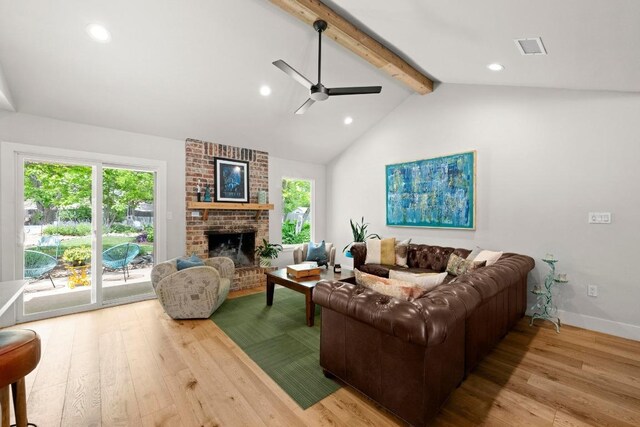 living room featuring ceiling fan, lofted ceiling with beams, a brick fireplace, recessed lighting, and wood finished floors