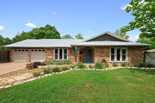 single story home featuring brick siding, driveway, a front yard, and a garage