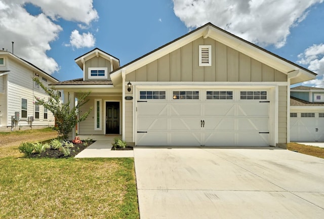 155 Lyndon Dr, San Marcos, TX 78666 - craftsman-style home with board and batten siding, an attached garage, driveway, and a front lawn