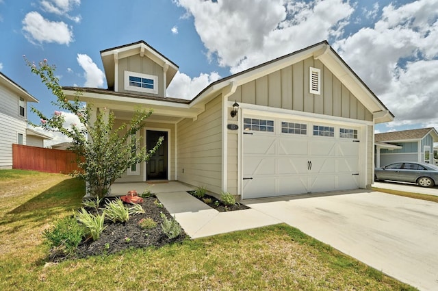 155 Lyndon Dr, San Marcos, TX 78666 - view of front of house featuring fence, a garage, board and batten siding, a front yard, and driveway