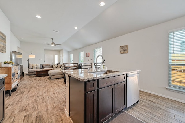 155 Lyndon Dr, San Marcos, TX 78666 - kitchen with ceiling fan, light stone counters, a sink, light wood finished floors, and dishwasher