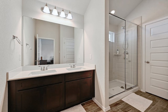 155 Lyndon Dr, San Marcos, TX 78666 - full bathroom featuring a sink, a shower stall, and double vanity