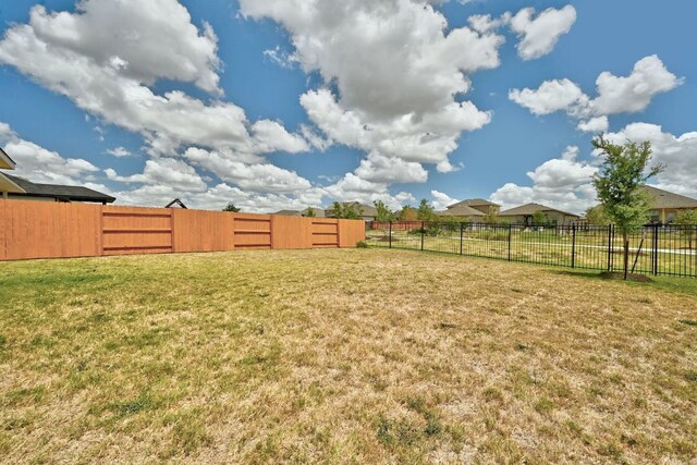 155 Lyndon Dr, San Marcos, TX 78666 - view of yard featuring a fenced backyard