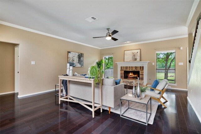 living area featuring baseboards, ceiling fan, dark wood-style floors, and visible vents