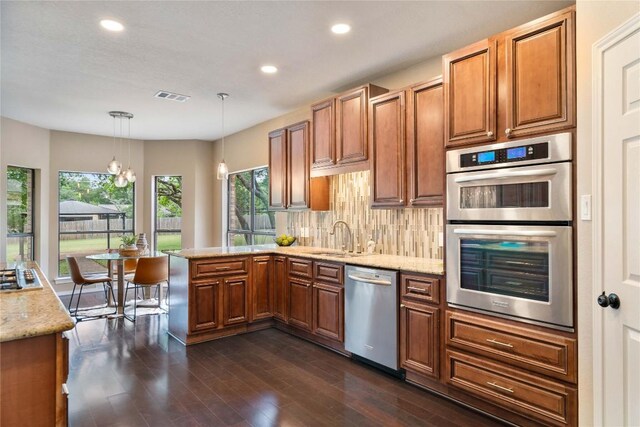 kitchen featuring appliances with stainless steel finishes, plenty of natural light, recessed lighting, and visible vents